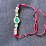 Rakhi green stone kundan