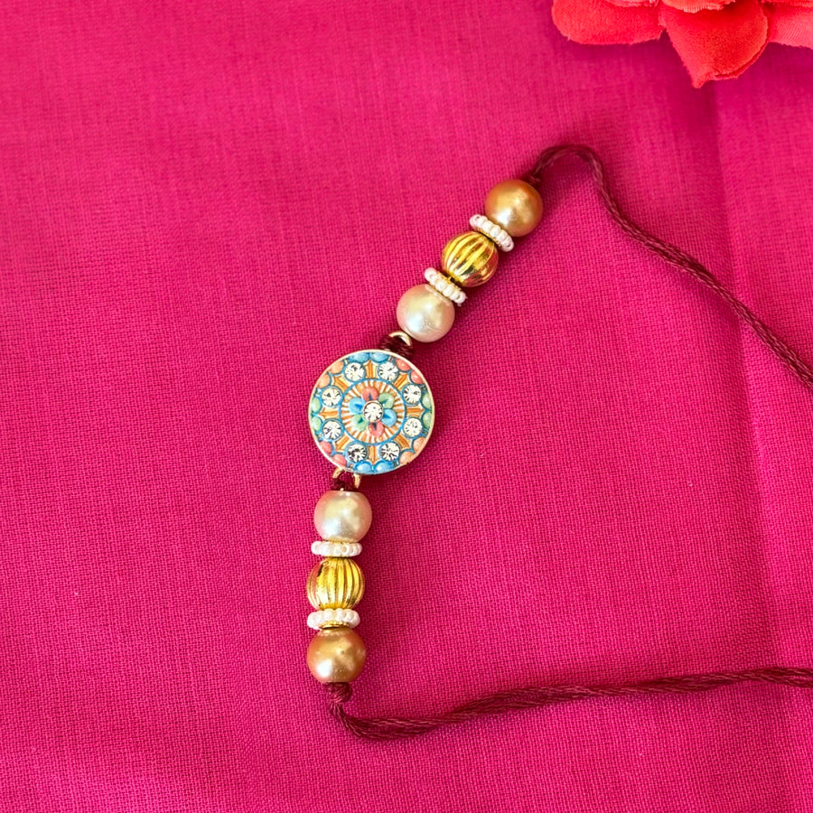 rakhi-blue and pink with stone -round