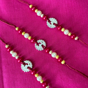 Rakhi- ohm silver pendent and beads(set of 3)