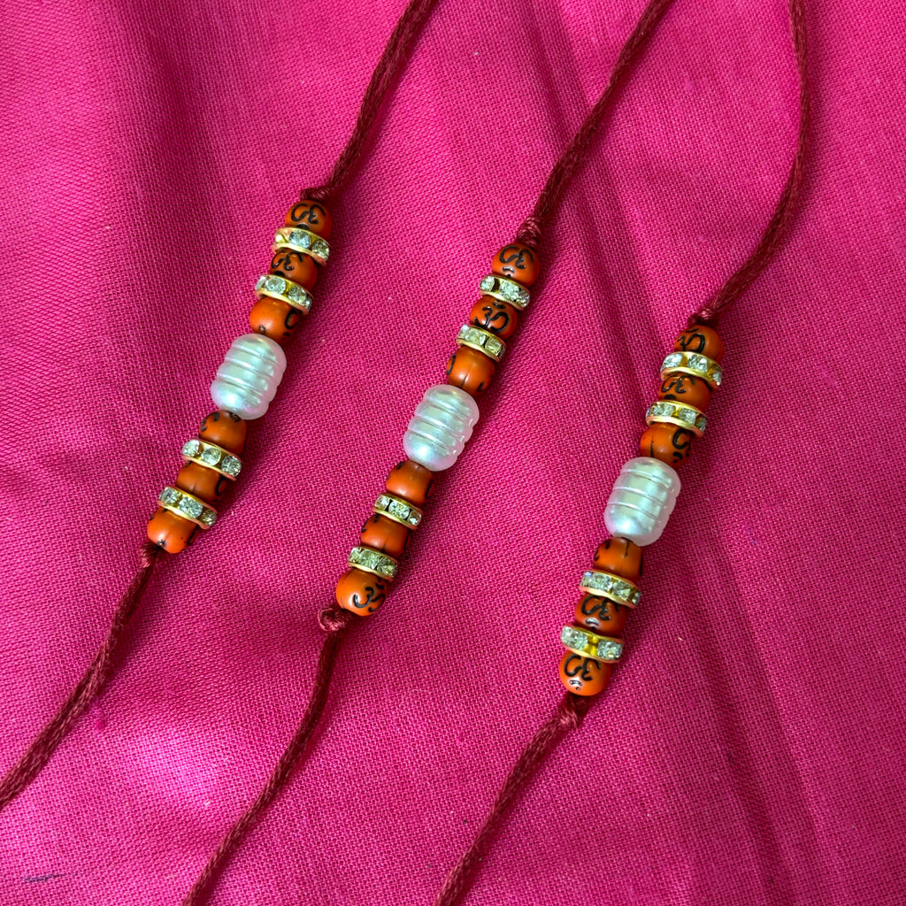 Rakhi- ohm printed beads and white bead(set of 3)