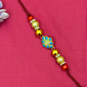 rakhi-blue flower with white stone -centered