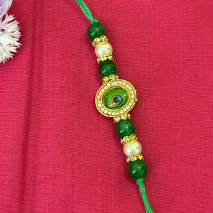 Peacock Feather Kundan Rakhi – oval