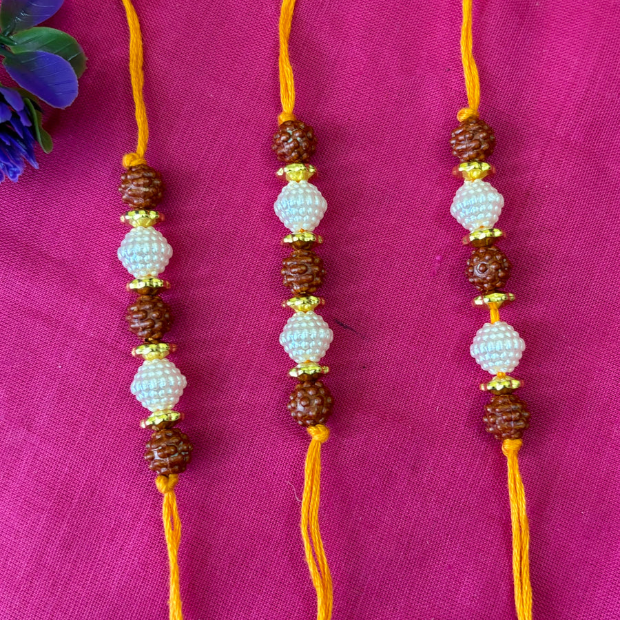 Rakhi- Rudraksha (replica) and white ball(set of 3)