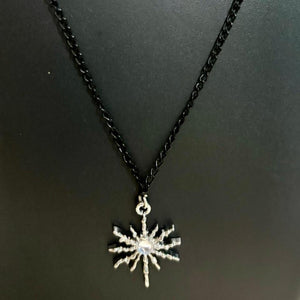black chain with white stone pendent