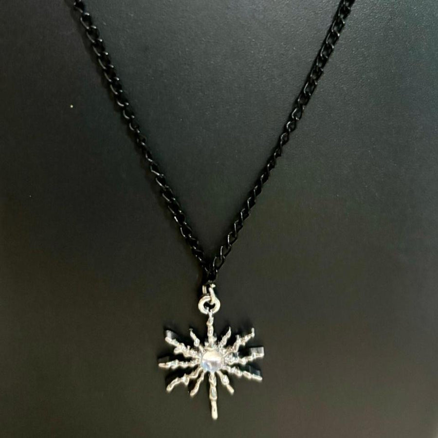 black chain with white stone pendent