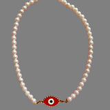 Pearl necklace with evil eye charm