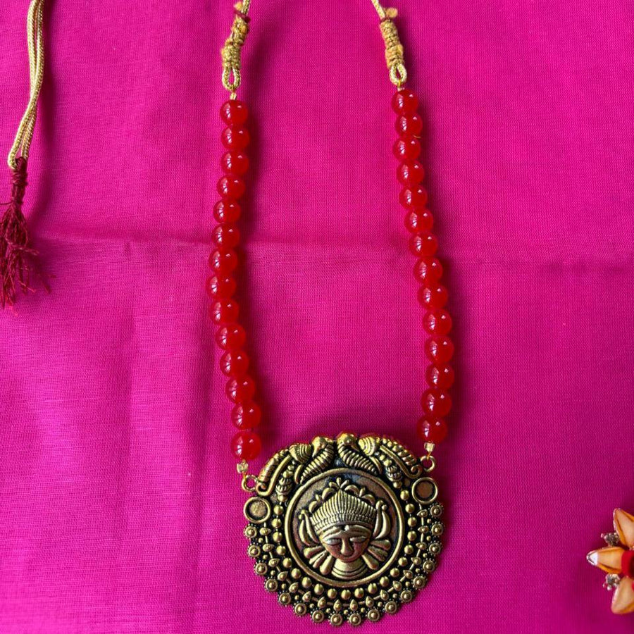 Red Glass bead necklace with  golden aloy pendent