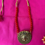 Red Glass bead necklace with  golden aloy pendent